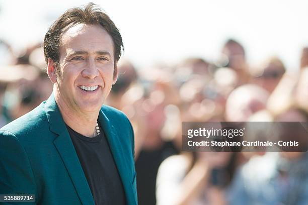 Nicolas Cage poses next to the beach closet dedicated to him during a photocall on the Promenade des Planches for the movie 'Joe', during the 39th...