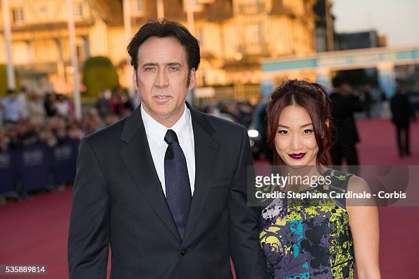 Nicolas Cage and his wife Alice Kim attend the premiere of the movie 'Joe' during the 39th Deauville American Film Festival, in Deauville.