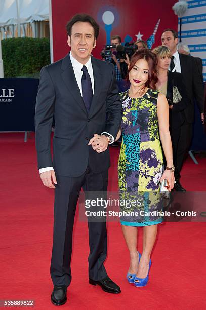 Nicolas Cage and his wife Alice Kim attend the premiere of the movie 'Joe' during the 39th Deauville American Film Festival, in Deauville.
