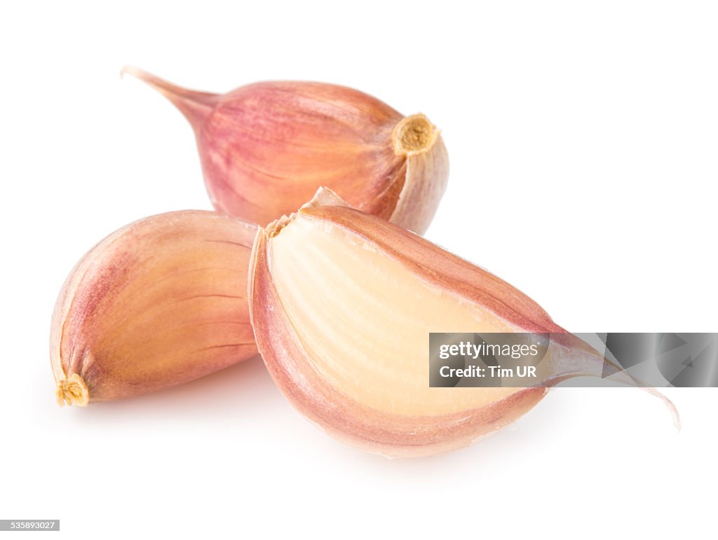 Cloves of garlic isolated on white background