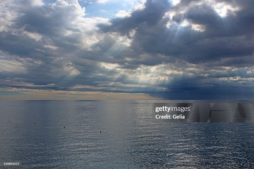 Sun's rays passing through the storm clouds