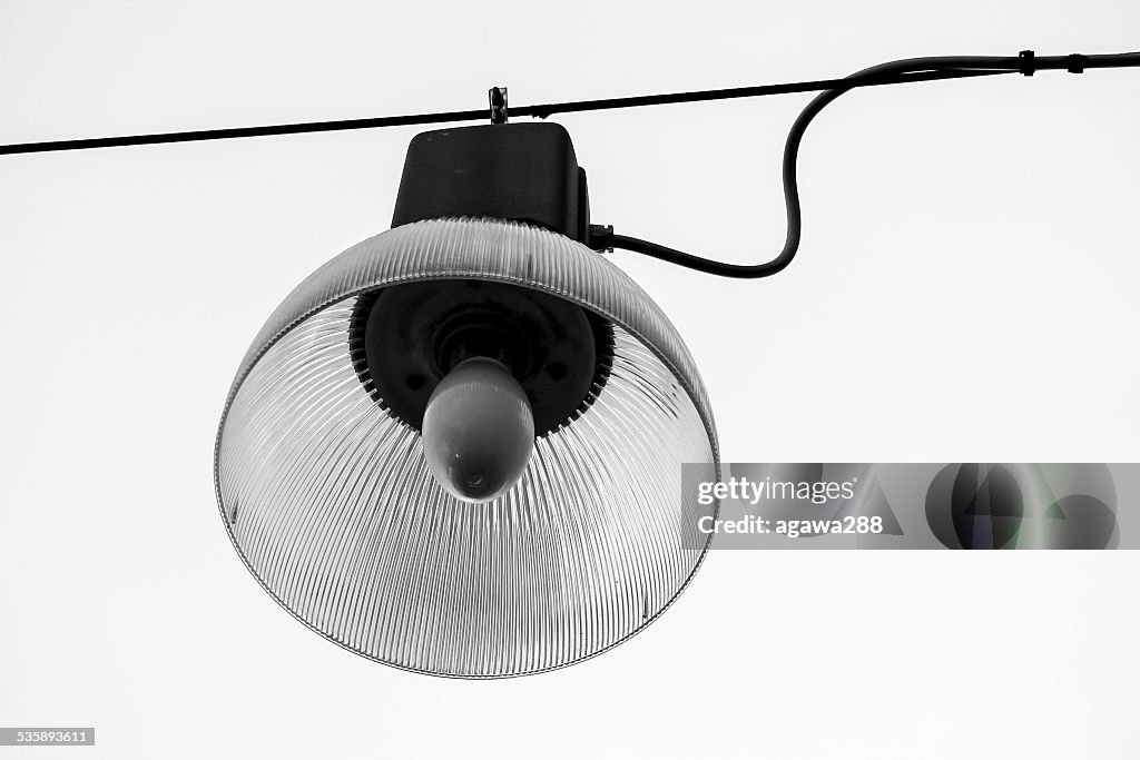 Retro hanging street lamp. Isolated on white. Black and white