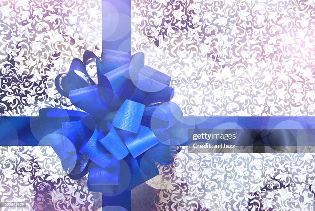 Gift with blue bow and ribbon