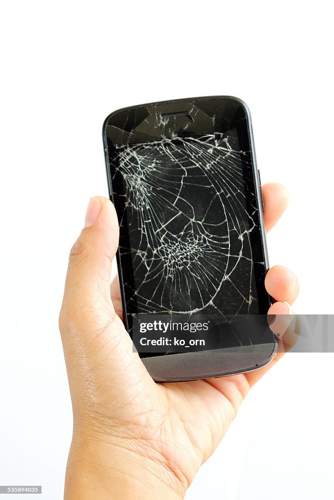 Woman hand with broken phone,