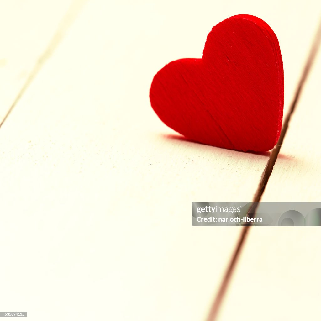 Red Heart On Wooden Background.