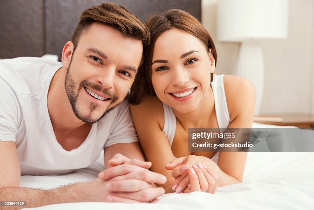 Loving couple in bed.