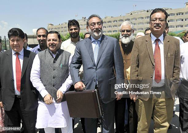 Jammu and Kashmir Finance Minister Haseeb Drabu arrives at Assembly House to present budget 2016-17, on May 30, 2016 in Srinagar, India. Since Jammu...