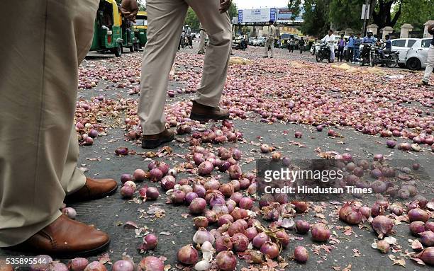 Onions that were thrown in front of Collectorate by farmers from Bijalpur and Rau as part of their protest on May 30, 2016 in Indore, India. A bumper...
