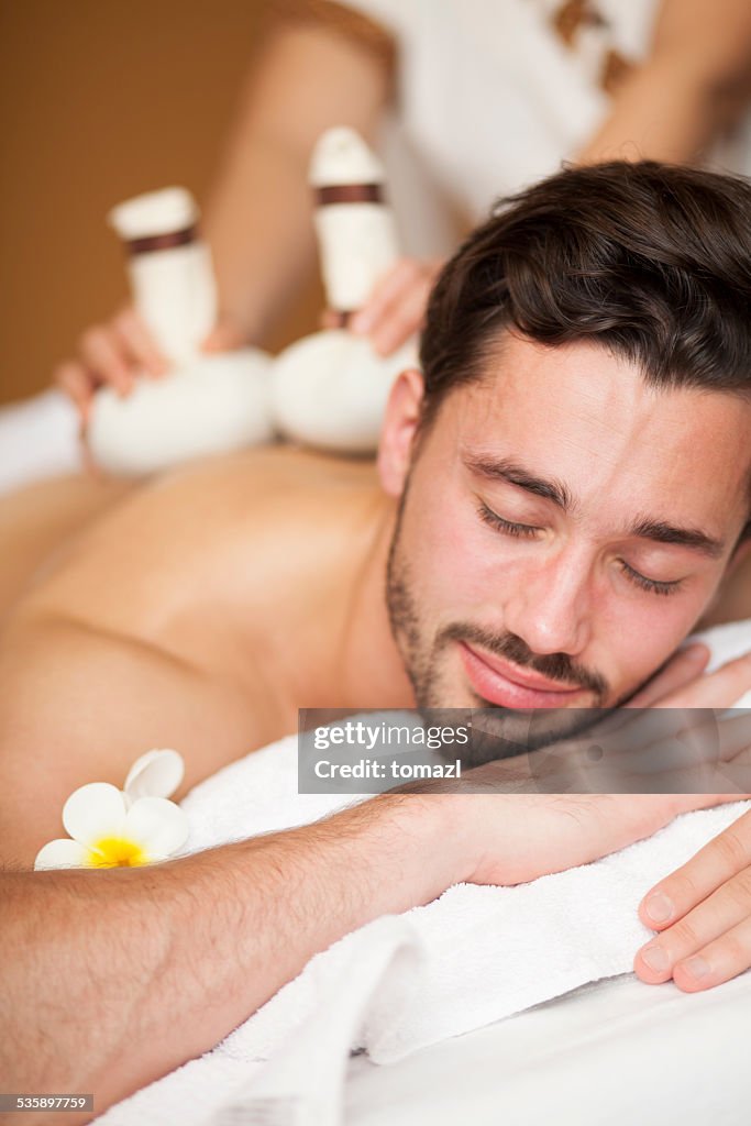 Thai massage of a man's back