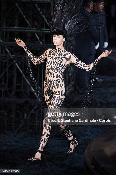 Model walks the runway during Louis Vuitton show at 'Cour Carre du Louvre', as part of the Paris Fashion Week Womenswear Spring/Summer 2014, in Paris.