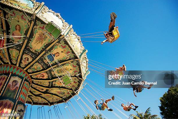 children going around in an amusement park ride - anaheim california stock pictures, royalty-free photos & images