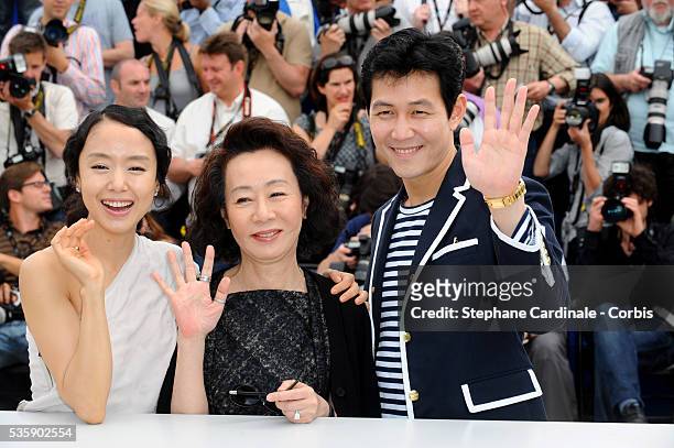 Jeon Do-yeoun, Youn Yuh Jung and Lee Jung Jae at the photocall for "The Housemaid" during the 63rd Cannes International Film Festival.