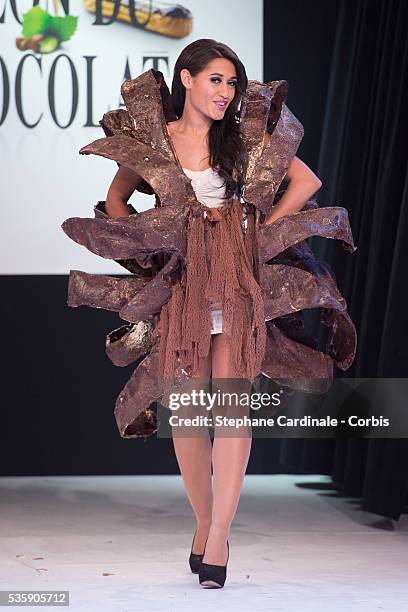 Actress Josephine Jobert walks the runway and wears 'Eclosion' a chocolate dress made by designer Stephane Martello and chocolate maker Bruno Rouly...