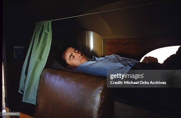 View of as a truck driver, sleeps in his Mack Truck for Cooper Jarrett Motor Freight Lines in Illinois.