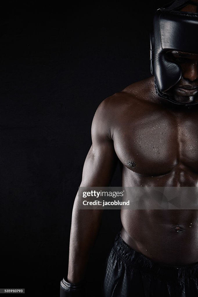 Muscular body of african male boxer