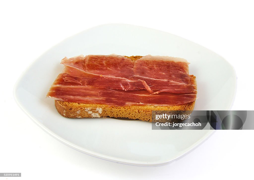 Serrano ham on toasted bread. Jabugo. Spanish tapa