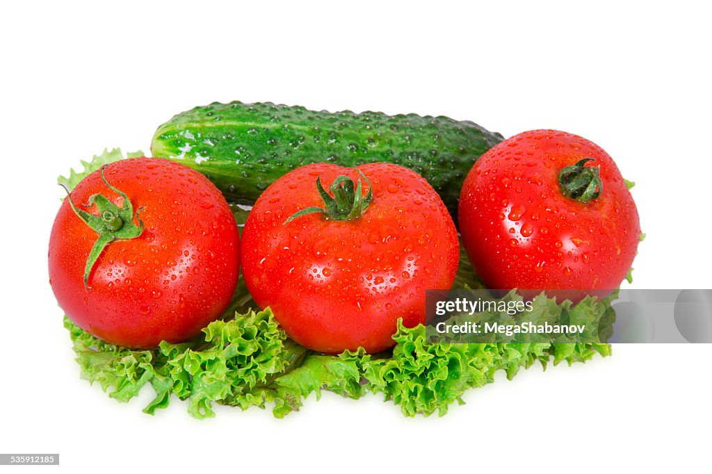 Three tomatoes and cucumber