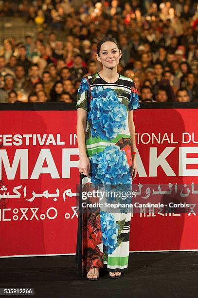 Marion Cotillard presents the Michael Mann film ''Public Enemies' at Jemaa El Fna square at 13th Marrakech International Film Festival, in Marrakech