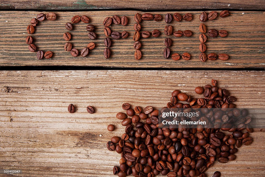 Coffee beans on wooden background