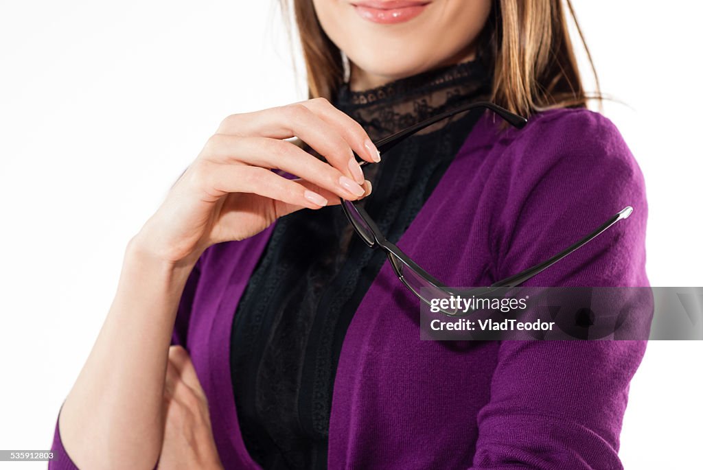 Business woman holding eyeglassess