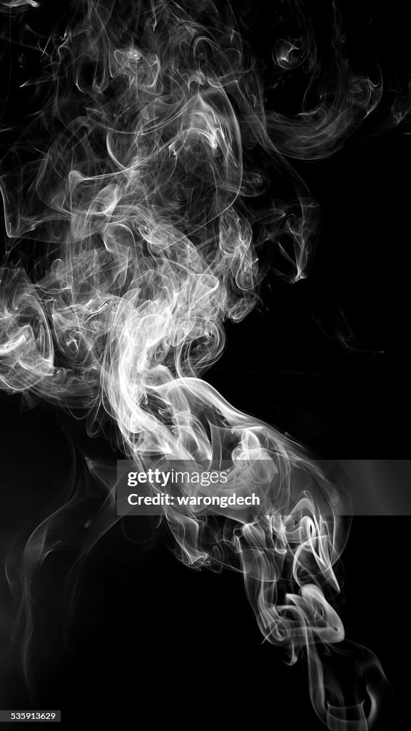 Abstract white smoke on black background.