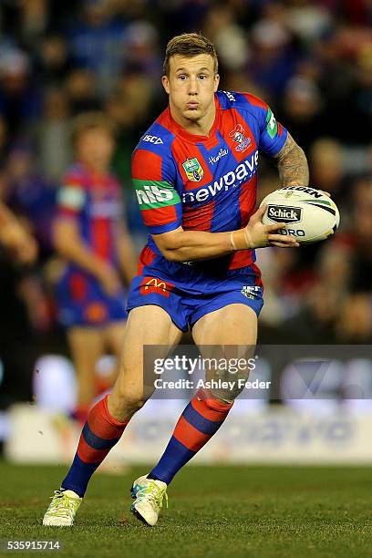 Trent Hodkinson of the Knights runs the ball during the round 12 NRL match between the Newcastle Knights and the Parramatta Eels at Hunter Stadium on...
