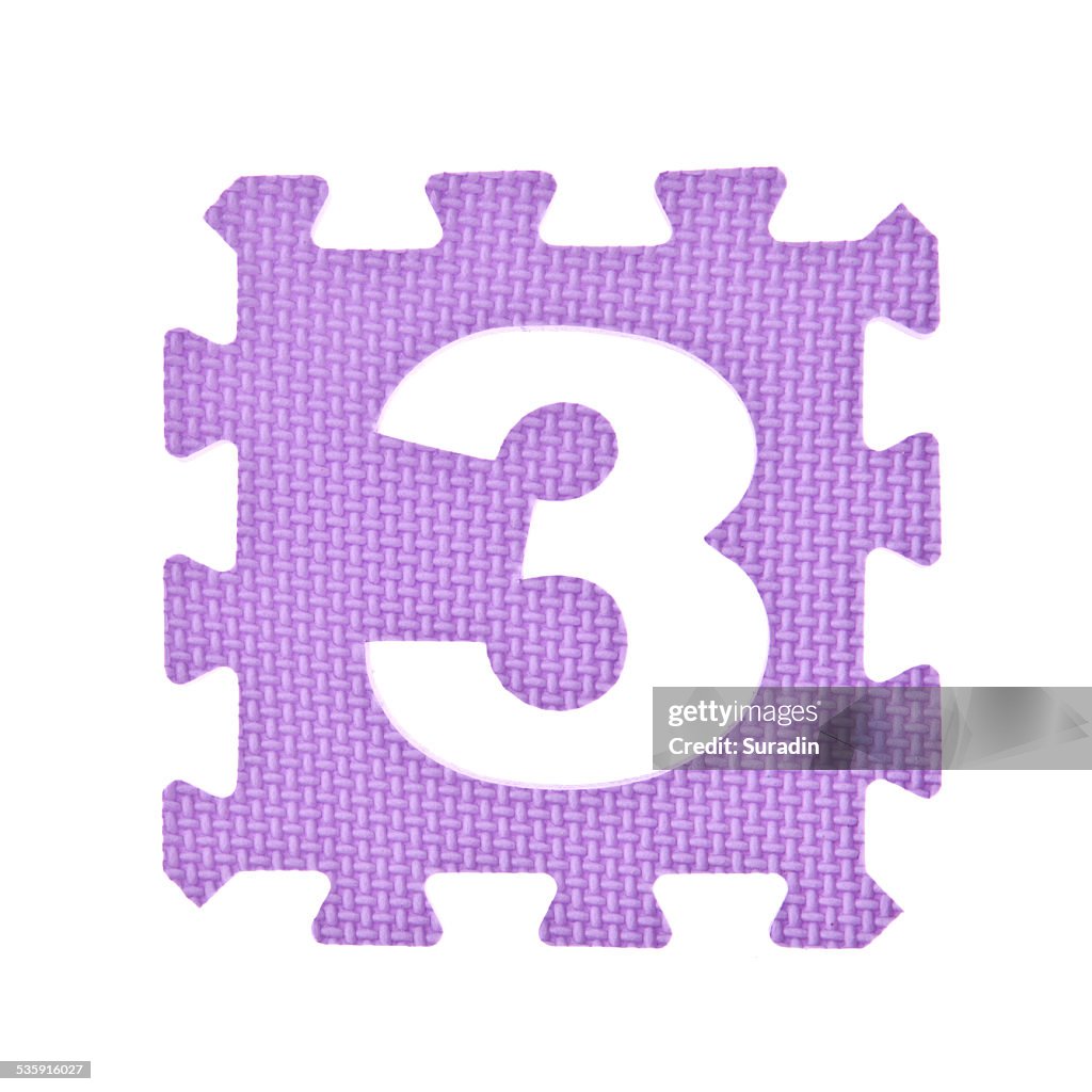 Numeric toy piece isolated on white background