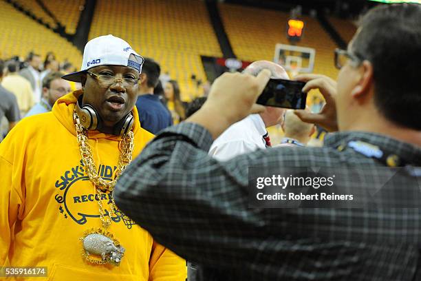 Recording artist E-40 poses for photos prior to Game Seven of the Western Conference Finals between the Golden State Warriors and the Oklahoma City...