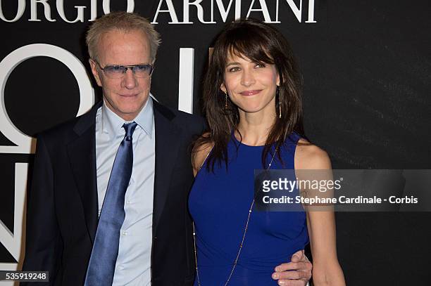 Christophe Lambert and Sophie Marceau attend the Giorgio Armani Prive show as part of Paris Fashion Week Haute Couture Spring/Summer 2014, at Palais...