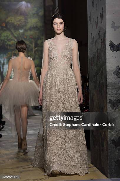 Model walks the runway during the Valentino show as part of Paris Fashion Week Haute Couture Spring/Summer 2014, in Paris.