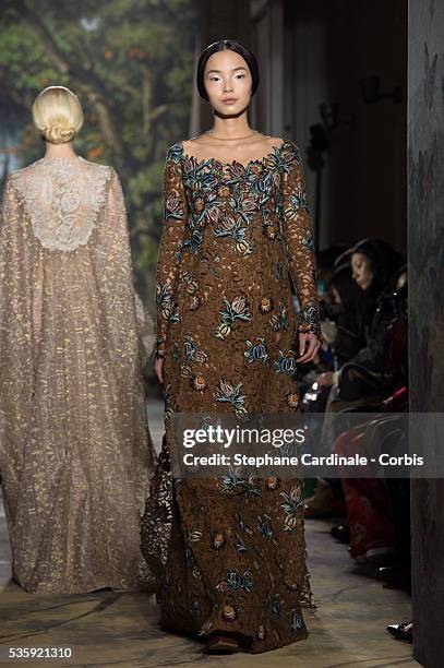 Model walks the runway during the Valentino show as part of Paris Fashion Week Haute Couture Spring/Summer 2014, in Paris.