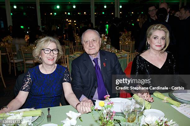 Genevieve Fioraso, Pierre Berge and Catherine Deneuve attend the Sidaction Gala Dinner at Pavillon d'Armenonville, in Paris.