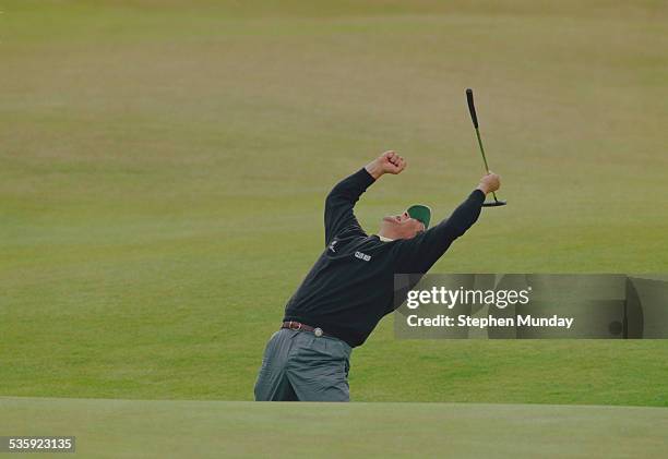 Costantino Rocca of Italy celebrates his birdie putt on the 18th green to force a playoff with John Daly on 23 July 1995 during the Open Championship...