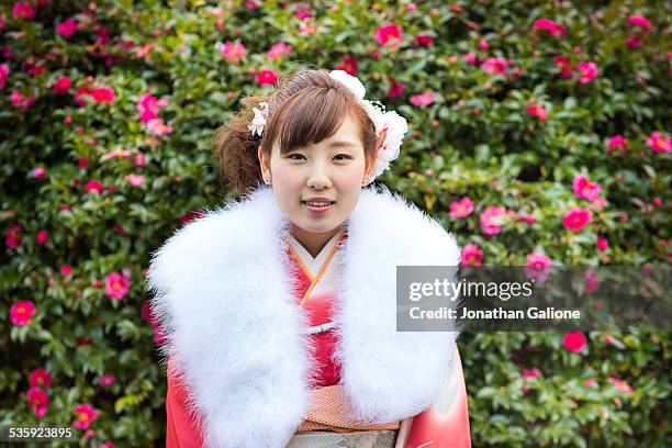 young woman wearing a kimono and fur collar - seijin no hi stock pictures, royalty-free photos & images