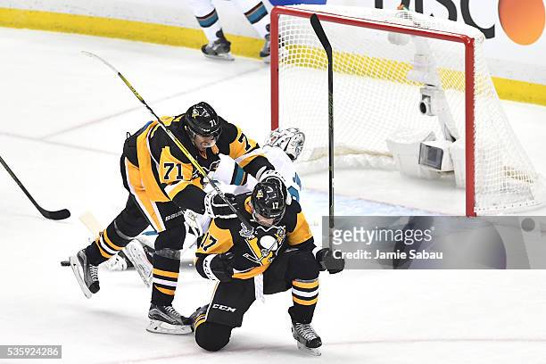 Bryan Rust of the Pittsburgh Penguins celebrates with Evgeni Malkin after scoring a first period goal against the San Jose Sharks in Game One of the...