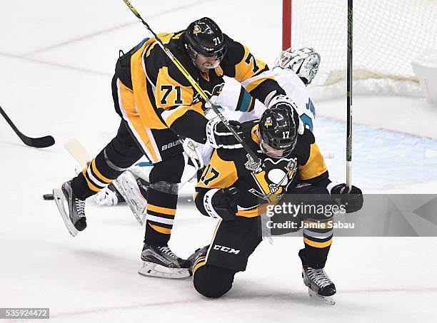 Bryan Rust of the Pittsburgh Penguins celebrates with Evgeni Malkin after scoring a first period goal against Martin Jones of the San Jose Sharks in...