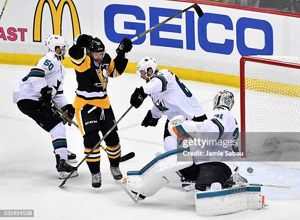 Bryan Rust of the Pittsburgh Penguins scores a first period goal against Martin Jones of the San Jose Sharks in Game One of the 2016 NHL Stanley Cup...