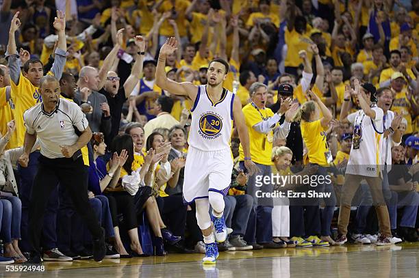 Stephen Curry of the Golden State Warriors reacts after a three-point shot in Game Seven of the Western Conference Finals against the Oklahoma City...