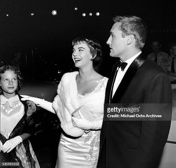 Actress Natalie Wood and actor Dennis Hopper attend the premiere of "Rebel without a Cause" in Los Angeles, CA. With them is Natalie's younger...