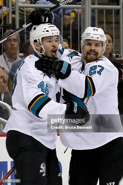 Tomas Hertl of the San Jose Sharks celebrates with Joonas Donskoi after scoring a second period goal against Matt Murray of the Pittsburgh Penguins...