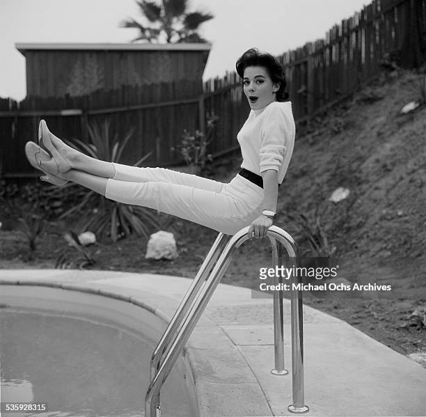 Actress Natalie Wood poses by her swimming pool at her home in Los Angeles,CA.
