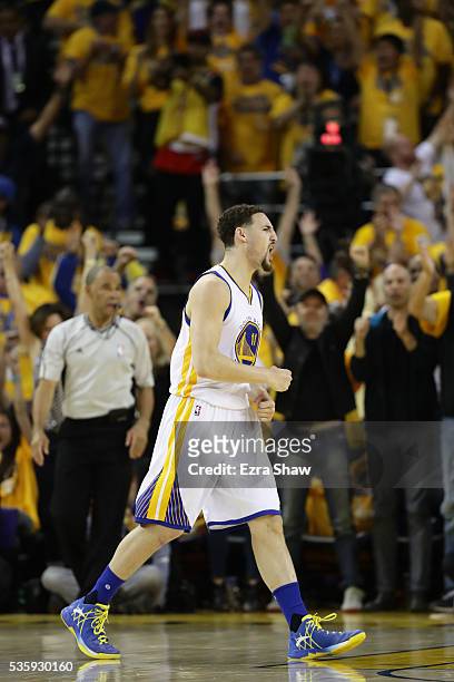 Klay Thompson of the Golden State Warriorsreacts after a three-point basket against the Oklahoma City Thunder in Game Seven of the Western Conference...
