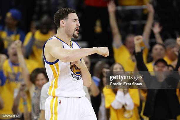 Klay Thompson of the Golden State Warriorsreacts after a three-point basket against the Oklahoma City Thunder in Game Seven of the Western Conference...