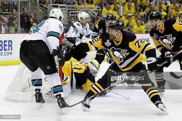 Patrick Marleau of the San Jose Sharks scores a second period goal against Matt Murray of the Pittsburgh Penguins as Patric Hornqvist defends in Game...
