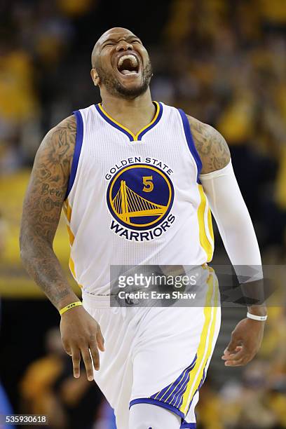 Marreese Speights of the Golden State Warriors reacts after making a three-point basket against the Oklahoma City Thunder in Game Seven of the...