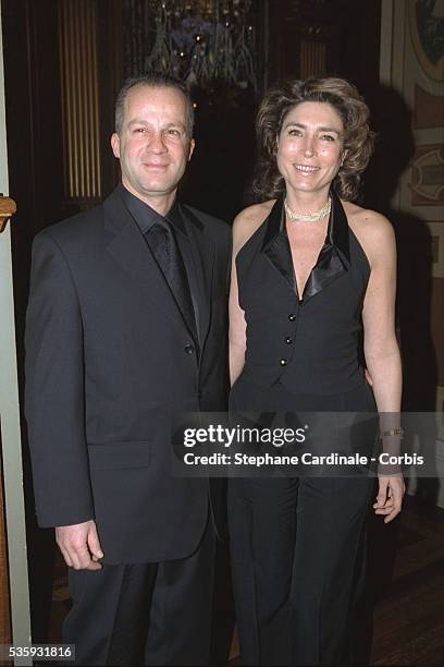 Television presenter Marie-Ange Nardi and a friend at the "Grand Prix d'Amerique" gala.