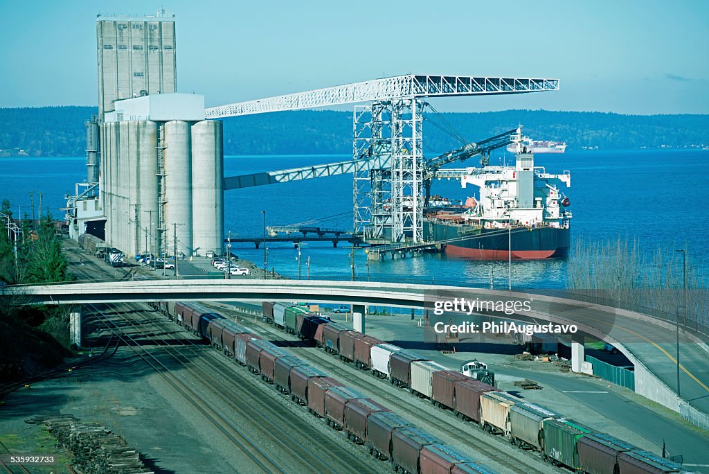 Freighter at grain loading facility in Tacoma WA