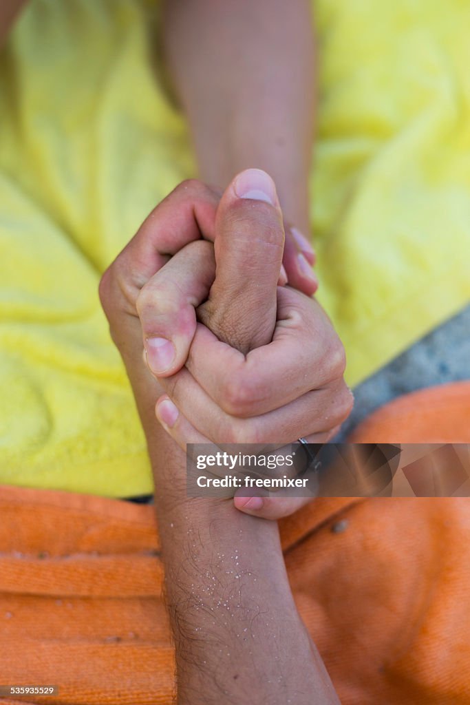 Couple holding hands