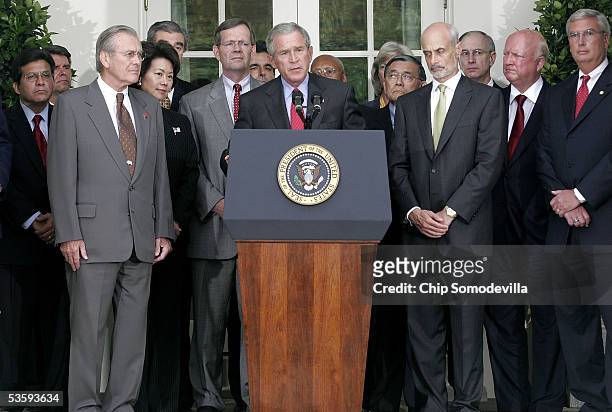 Surrounded by his cabinet in the Rose Garden at the White House, U.S. President George W. Bush makes a brief statement to the nation about the...