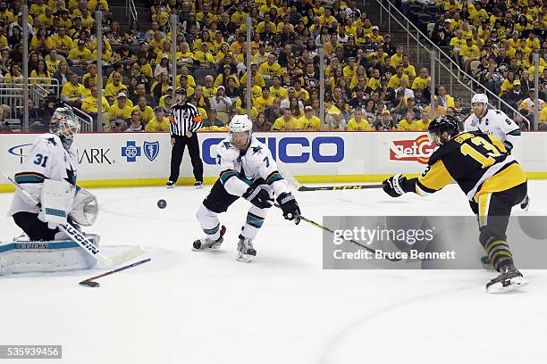 Nick Bonino of the Pittsburgh Penguins scores a third period goal against Martin Jones of the San Jose Sharks in Game One of the 2016 NHL Stanley Cup...